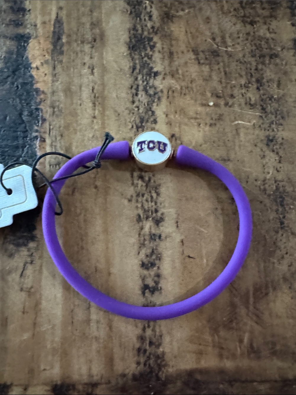 Purple Silicone Bracelet with TCU Logo Charm